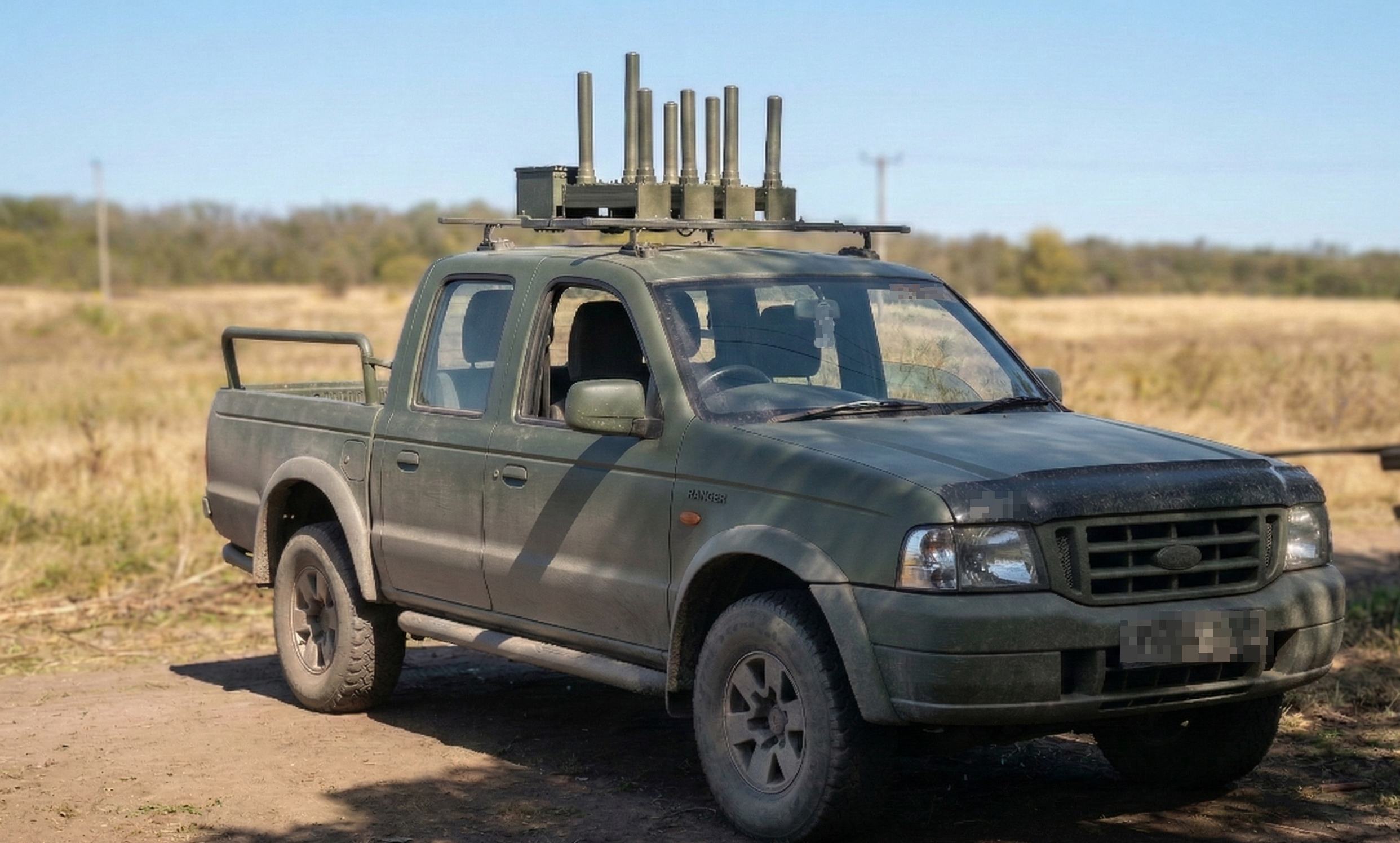 Khvylia EW system on a Ford Ranger in open field terrain